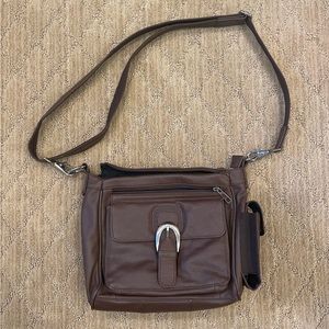 Brown leather CCW conceal carry bag.
